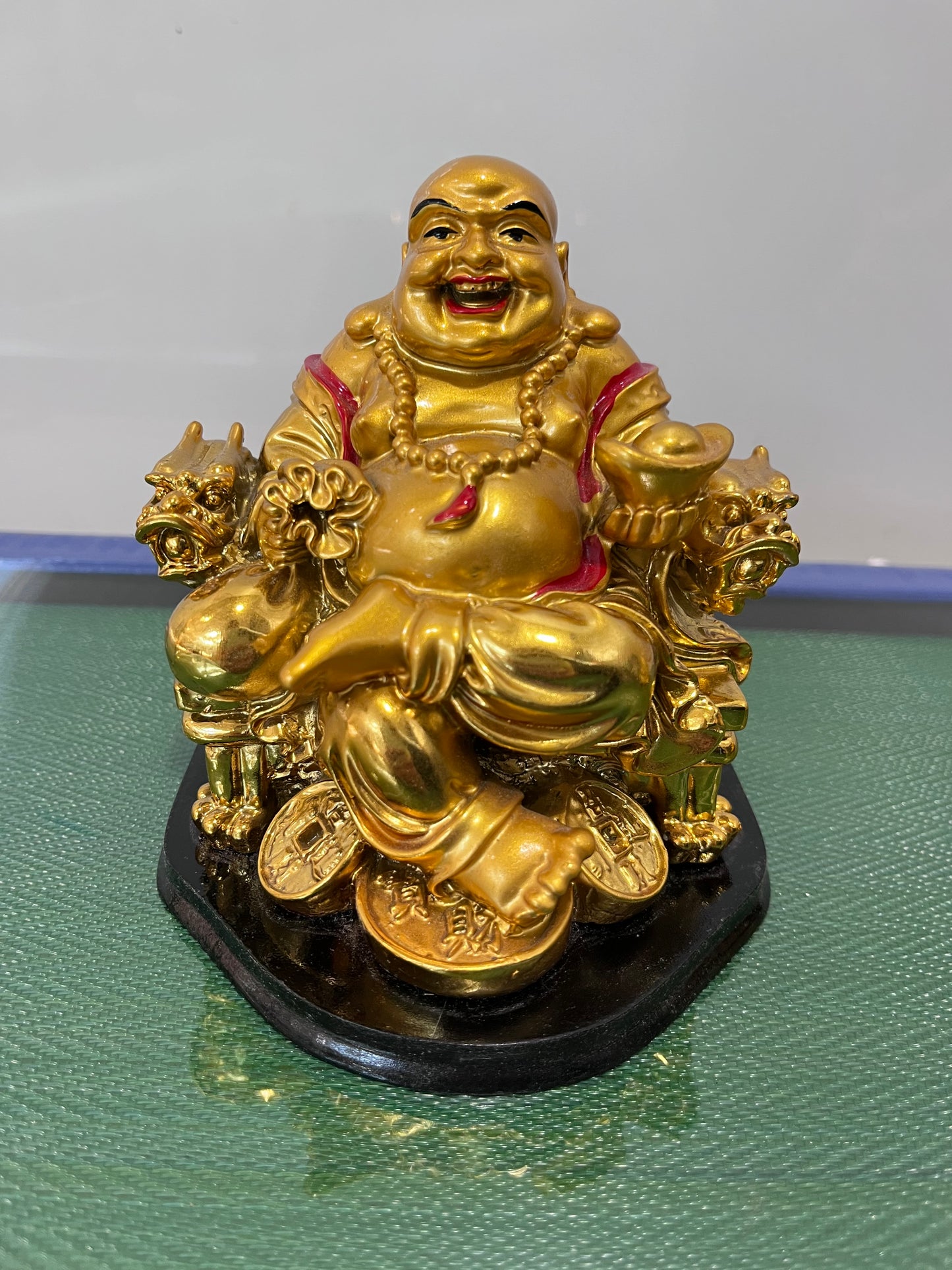 Golden Buddha on golden coins